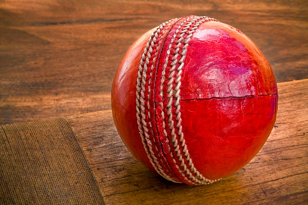 istock Cricket ball on wooden bat 91692345