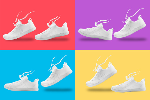 Pair of White sneaker four composition like walking and floating rope isolated on four color  background with clipping path