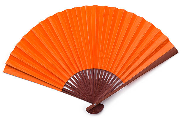 Opened Orange Asian Fan with Brown Stained Wood Isolated Isolated wooden orange asian fan on a white background hand fan photos stock pictures, royalty-free photos & images