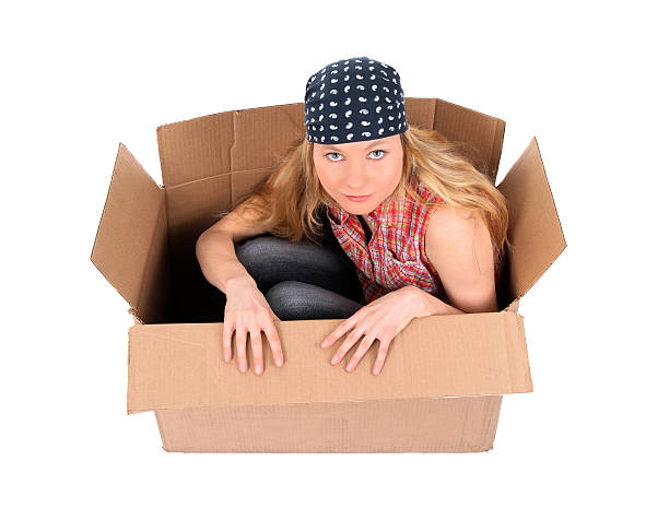 istock Cute girl sitting in a cardboard box 91693180