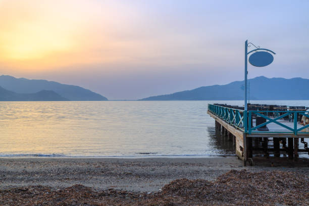 istock Pier with seats during sunset in Marmaris, Turkey 916932450