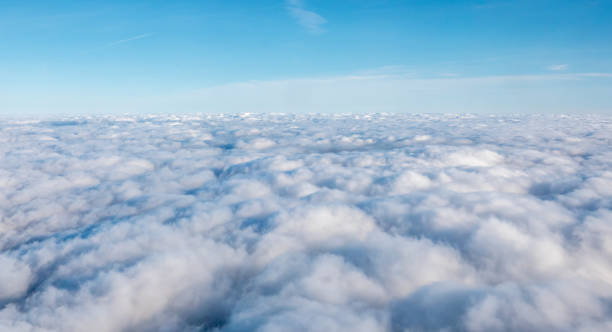 istock White Dense Cloud Covering with Blue Open Skies Above 916932570