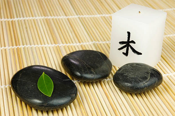 istock Black zen pebbles, green leaf and japanese candle 91693291