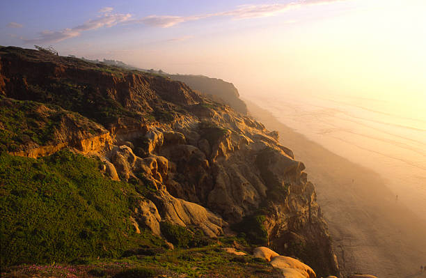 Evening at coastal cliffs over a beach in San Diego stock photo
