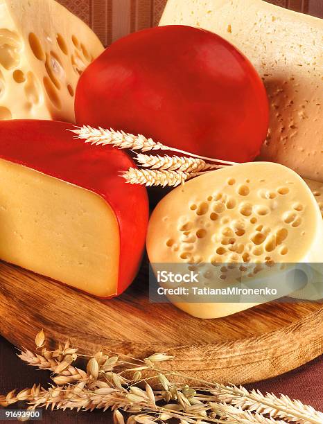 A Different Selection Of Cheeses On A Wooden Board Stock Photo - Download Image Now - Breakfast, Breakfast Cereal, Brie