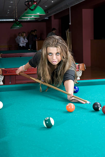 istock Girl in short skirt playing snooker 91694330