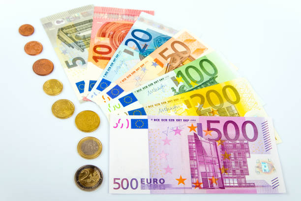istock Closeup of banknotes and coins 916944372