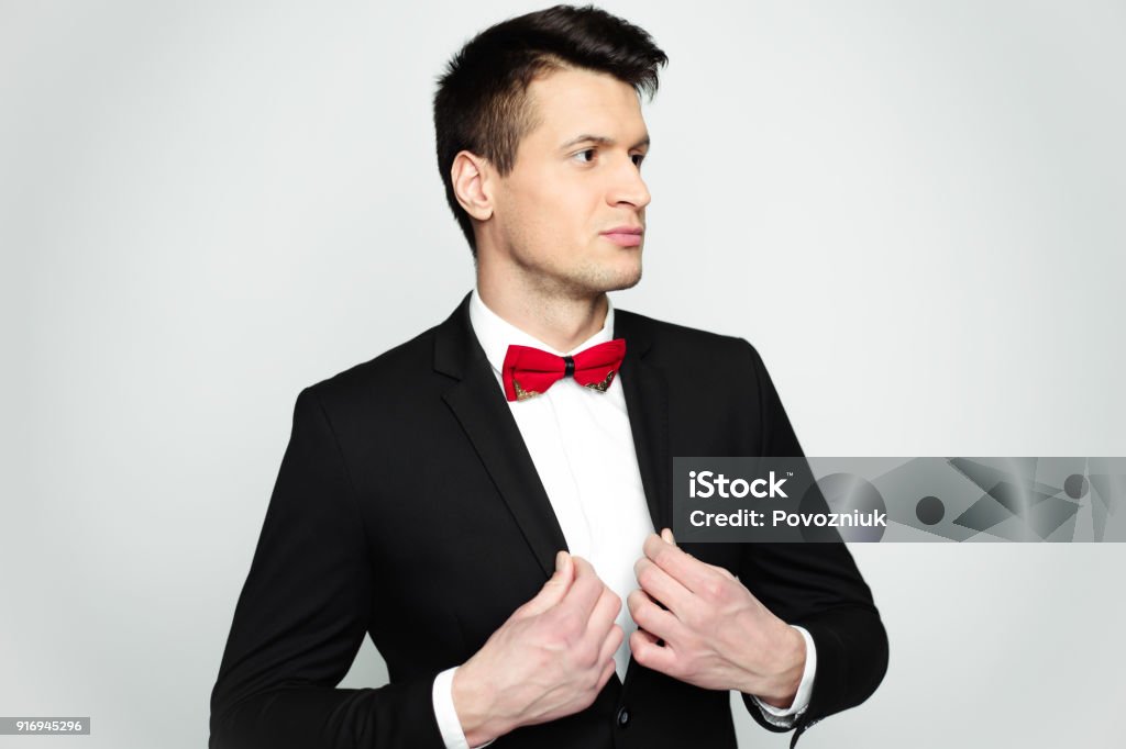 Have A Good Day Close Up Portrait Of Smiling Stylish Handsome Man In Black Suit And Red Bow Tie Isolated Stock Photo - Download Image Now - iStock Have A Good Day Close Up Portrait Of Smiling Stylish Handsome Man In Black Suit And Red Bow Tie Isolated Stock Photo - Download Image Now - Istock