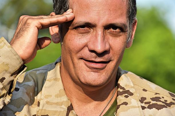 istock Veteran Soldier Saluting 916956122