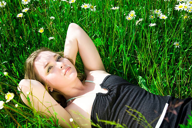 istock Woman Laying On The Grass 91696028