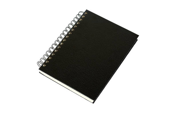 istock Black notebook for writing or drawing on spiral, isolated on white background 916962248