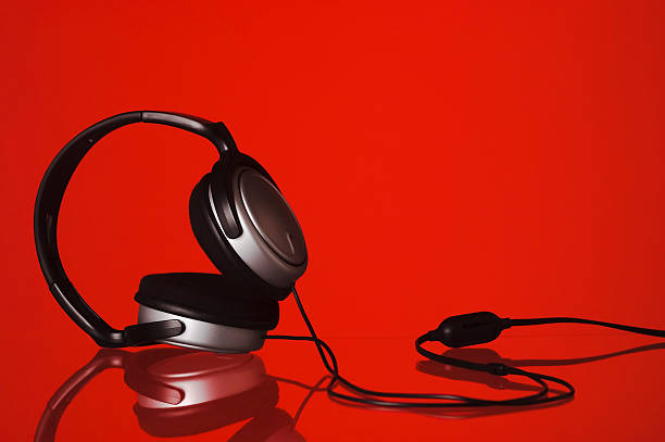 istock Headphones lying on a red background 91697031