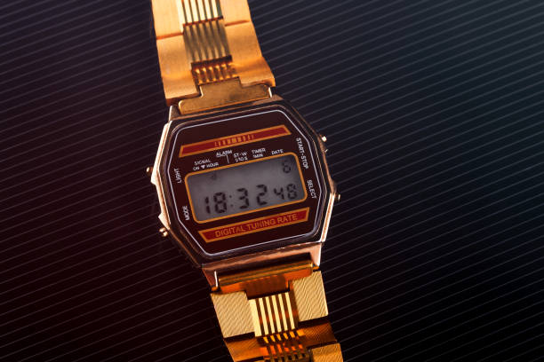 istock old-fashioned electronic wristwatch on black background. Toned 916973086