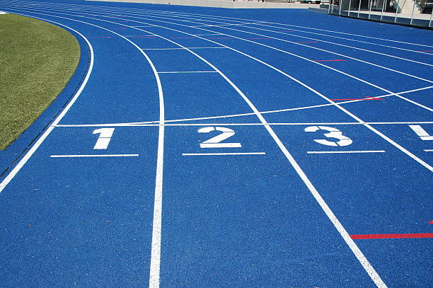 Blue running track  rubberized stock pictures, royalty-free photos & images