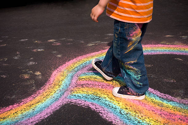 Chalk painting of a happy  sun on the pavement