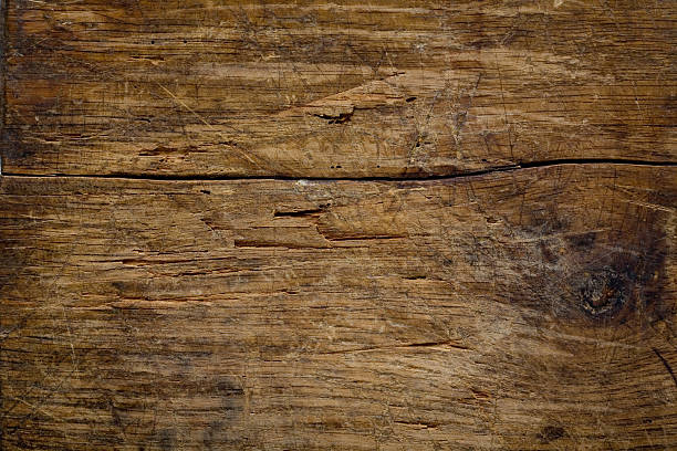 Wood with a crack through the center and scratch marks stock photo