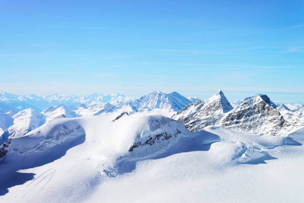 Jungfrau Moun peak at winter Swiss Alps Jungfrau Moun peak at winter Swiss Alps, helicopter view thun interlaken winter switzerland stock pictures, royalty-free photos & images