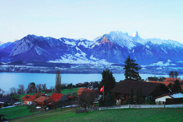 Sigrilwil village at Swiss Alps mountains and Thun lake Sigrilwil village at Swiss Alps mountains and Thun lake, Switzerland in winter thun interlaken winter switzerland stock pictures, royalty-free photos & images