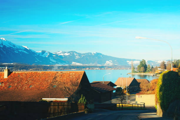Road in Sigrilwil village at Swiss Alps Thun lake Road in Sigrilwil village at Swiss Alps and Thun lake, Switzerland in winter thun interlaken winter switzerland stock pictures, royalty-free photos & images