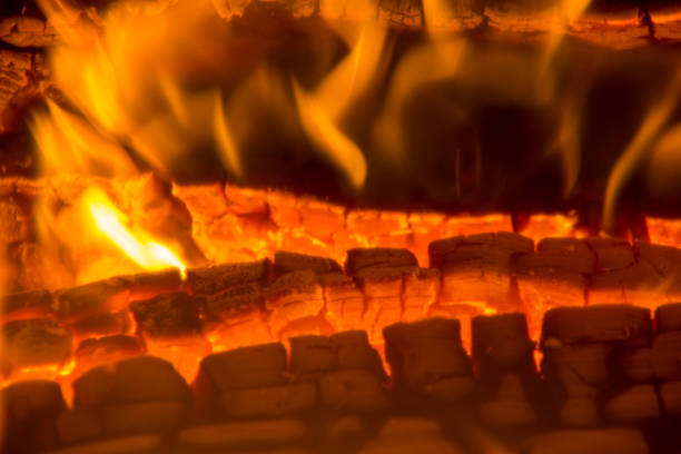 istock burning firewood coal closeup in the fireplace 916975462