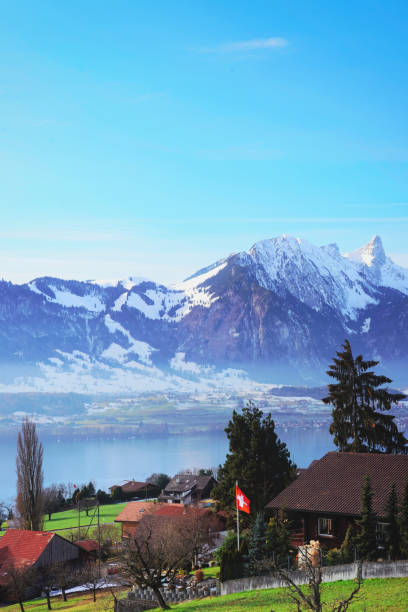Sigrilwil village at Swiss Alpine mountains with Thun lake Sigrilwil village at Swiss Alpine mountains with Thun lake, Switzerland in winter thun interlaken winter switzerland stock pictures, royalty-free photos & images