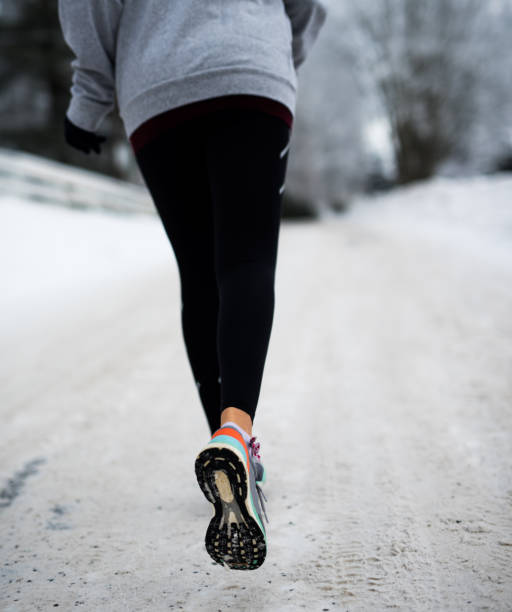 istock Close up of training shoe at winter day. 916975550
