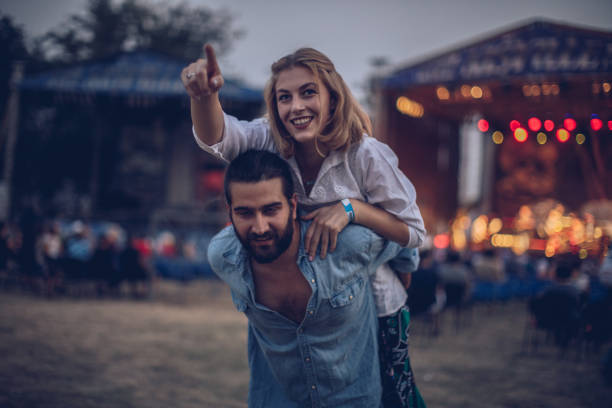 istock Cute couple fun on festival 916978694