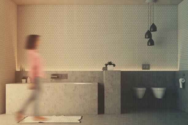 istock White bathroom, gray tub blur 916978874