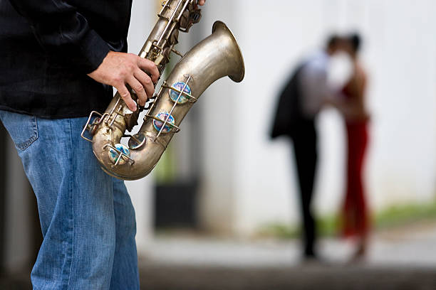 Romantic Couple Kissing With Jazz Saxophone