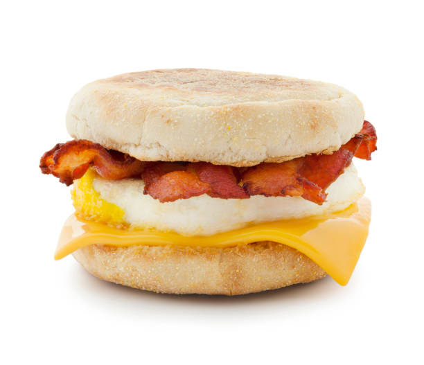 Breakfast Sandwich Bacon breakfast sandwich with egg and cheese slice isolated on white (excluding the shadow) breakfast sandwhich stock pictures, royalty-free photos & images