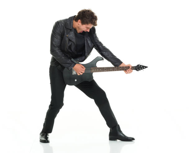 istock Attractive man playing electric guitar 916983246