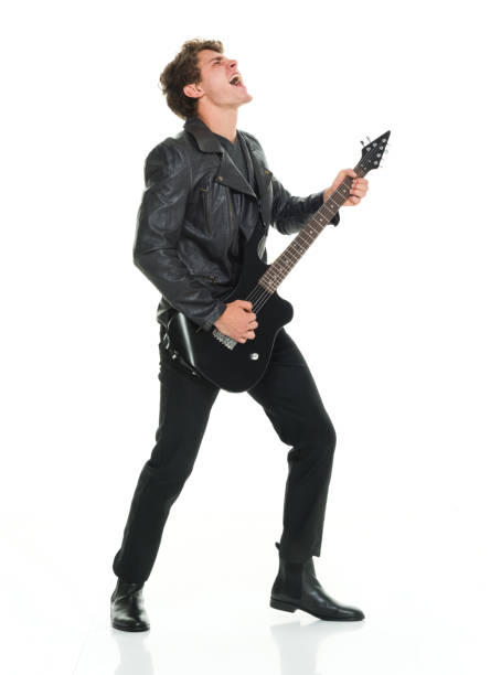 istock Attractive man playing electric guitar 916983276