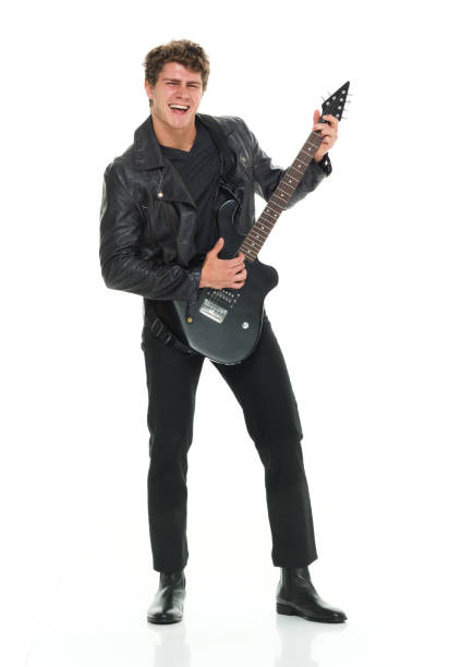 istock Attractive man playing electric guitar 916985512