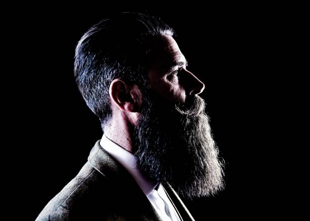 istock Smart Man with beard and moustache wearing suit 916985804