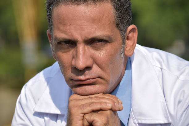 istock Unhappy Diverse Male Medic 916986160