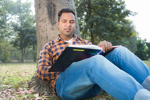 istock College boy in park 916989812