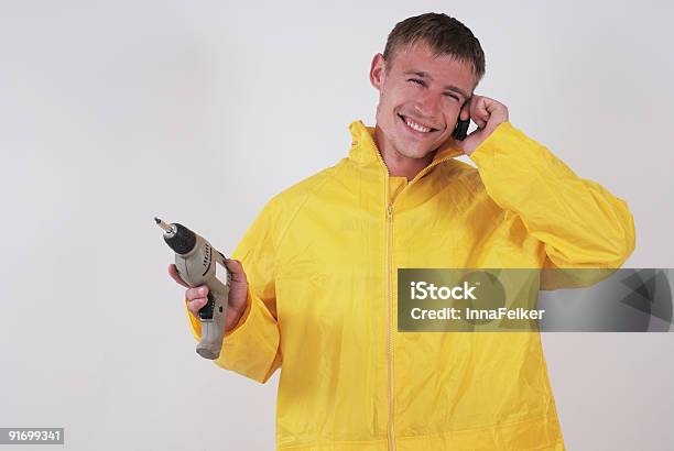 Trabajador Sonriente Foto de stock y más banco de imágenes de Adulto - Adulto, Alegre, Amarillo - Color