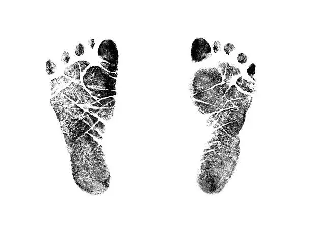 Photo of Newborn Infant Baby Footprint Ink Stamp Impressions Isolated