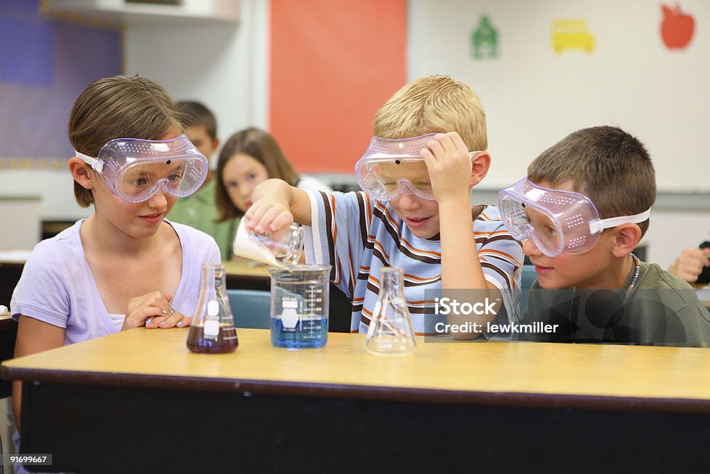 Elementary school students doing a science experiment  Child Stock Photo