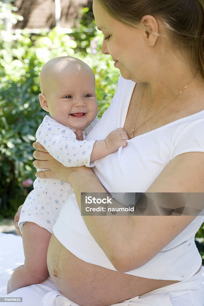 Pregnant woman with baby girl  Adult Stock Photo