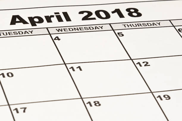 istock Close up calendar paper sheet. April 2018. 917001258