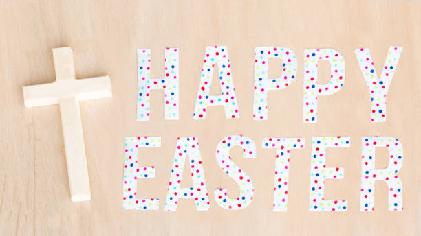 istock Bright Happy Easter text, chick, flowers, wood cross and background. Copy space 917004178