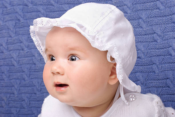 istock Surprised baby girl in white cap 91700647