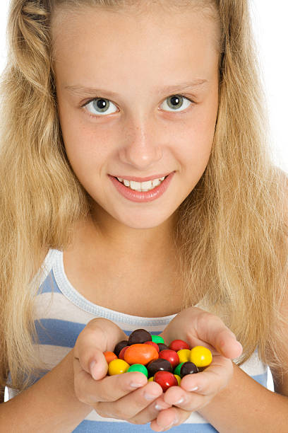 istock Young smiling girl with color chocolate candy 91700903