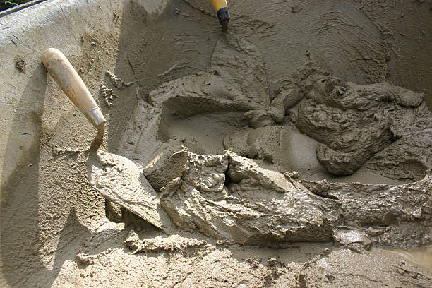 Mixing Cement Manually with Trowel stock photo