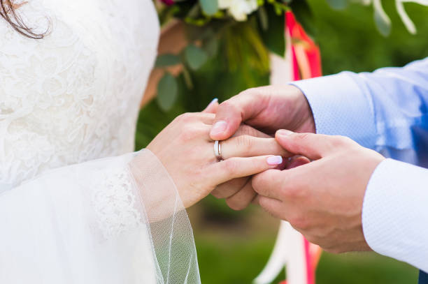 istock Close-up of bride hand with a ring in wedding day 917011580