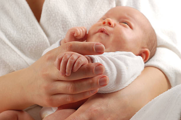 istock mother holding baby 91701288