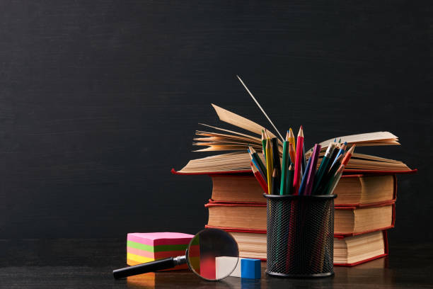istock School equipment on black desk, close-up. 917013820