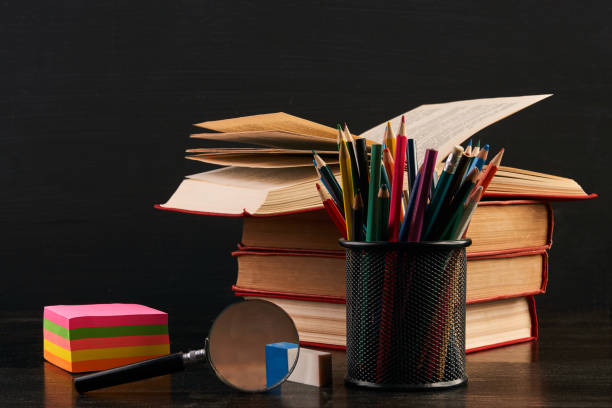 istock School equipment on black desk, close-up. 917013860