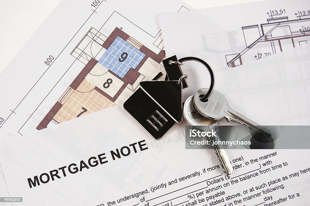 Keys on mortgage note  Architect Stock Photo
